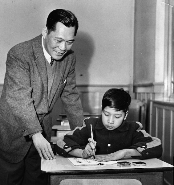David Lee, principal of the Chinese Public School, with a student (Photo courtesy of Kent Lee).
